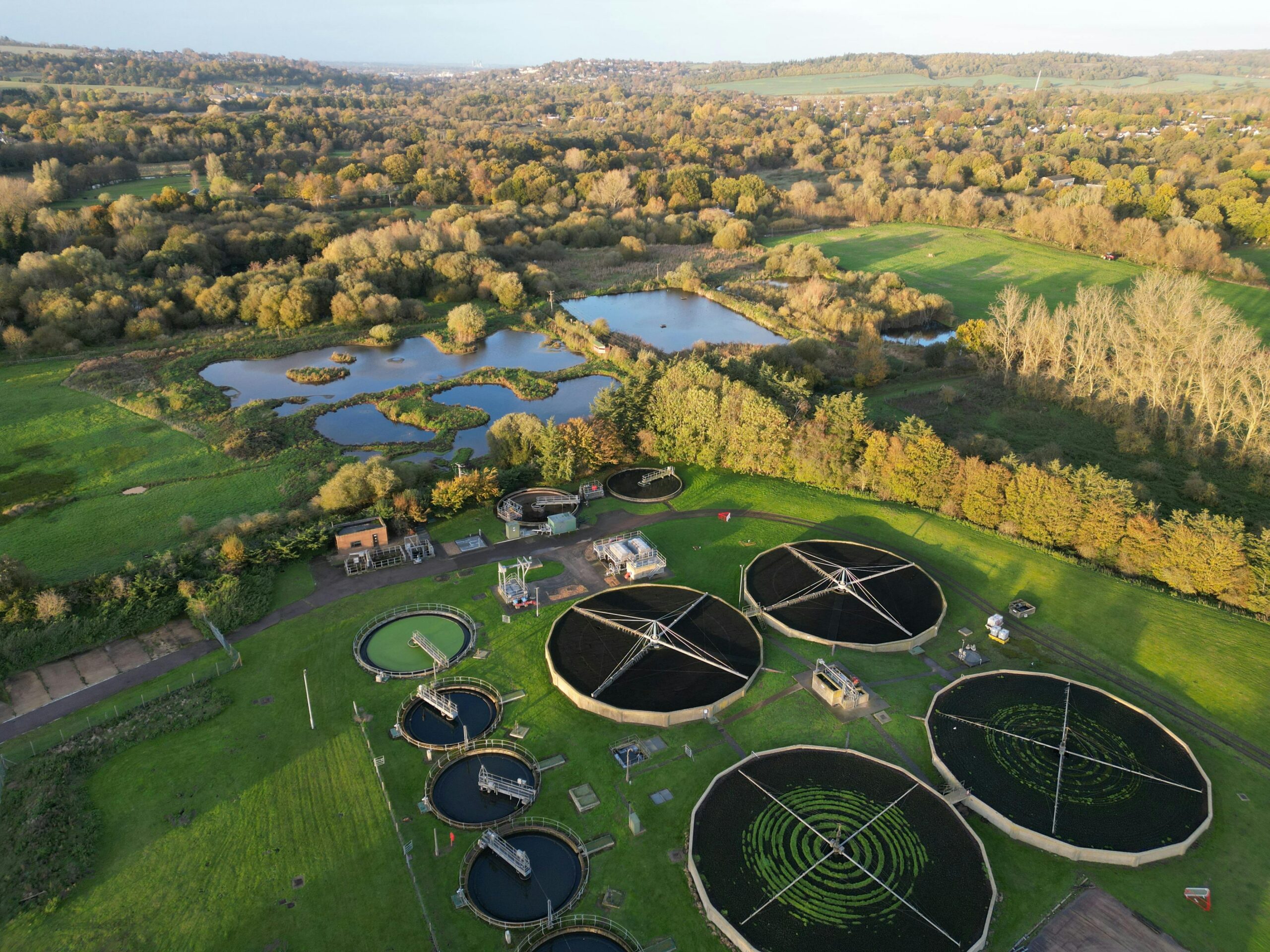 Clarification tanks and flocculation basins at a water treatment plant showing the multi-stage filtration and chemical coagulation process.