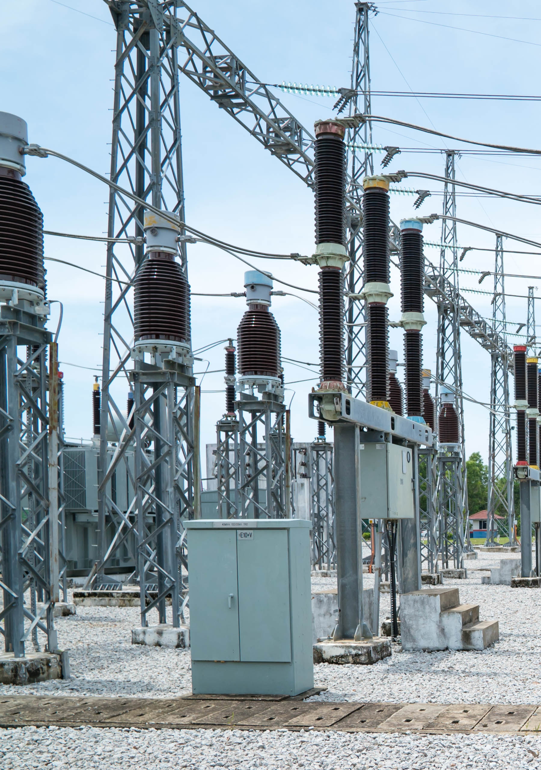 An outdoor air insulated switchgear (AIS) substation featuring high-voltage circuit breakers, isolators, and power transformers in a utility-scale grid.