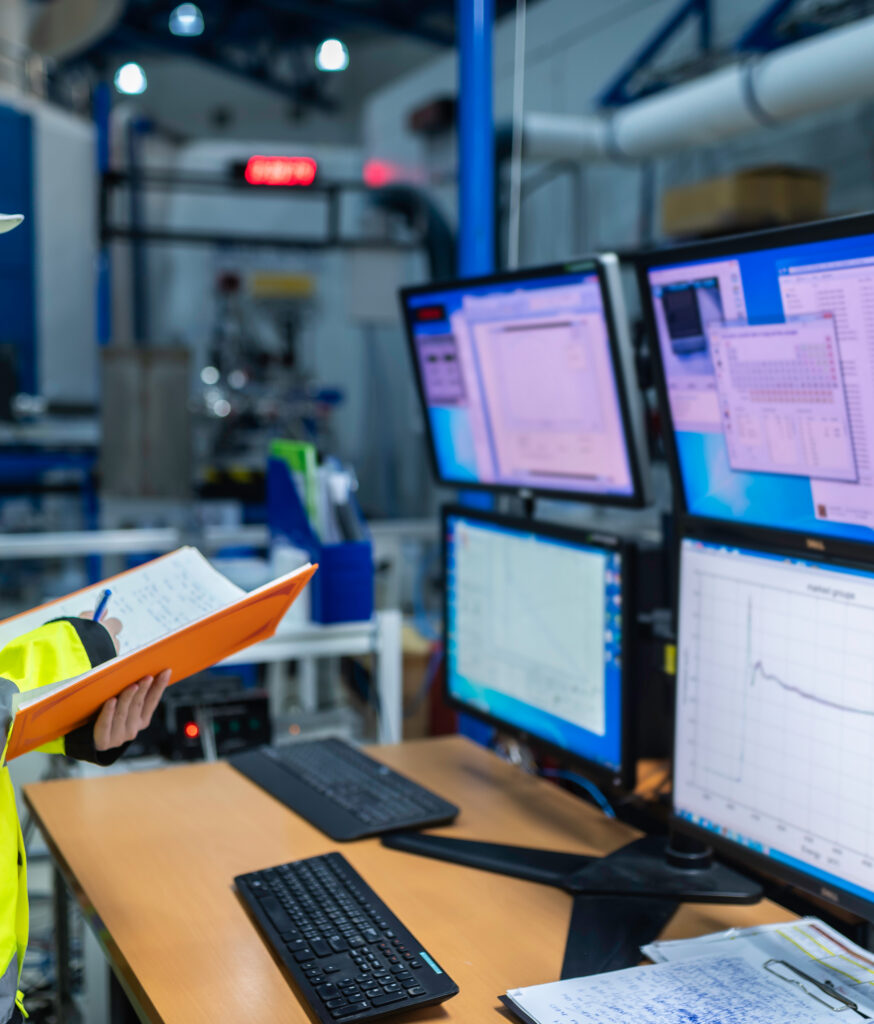 A digital dashboard displaying real-time KPIs, historical data trends, and alarm management for an automated production line.