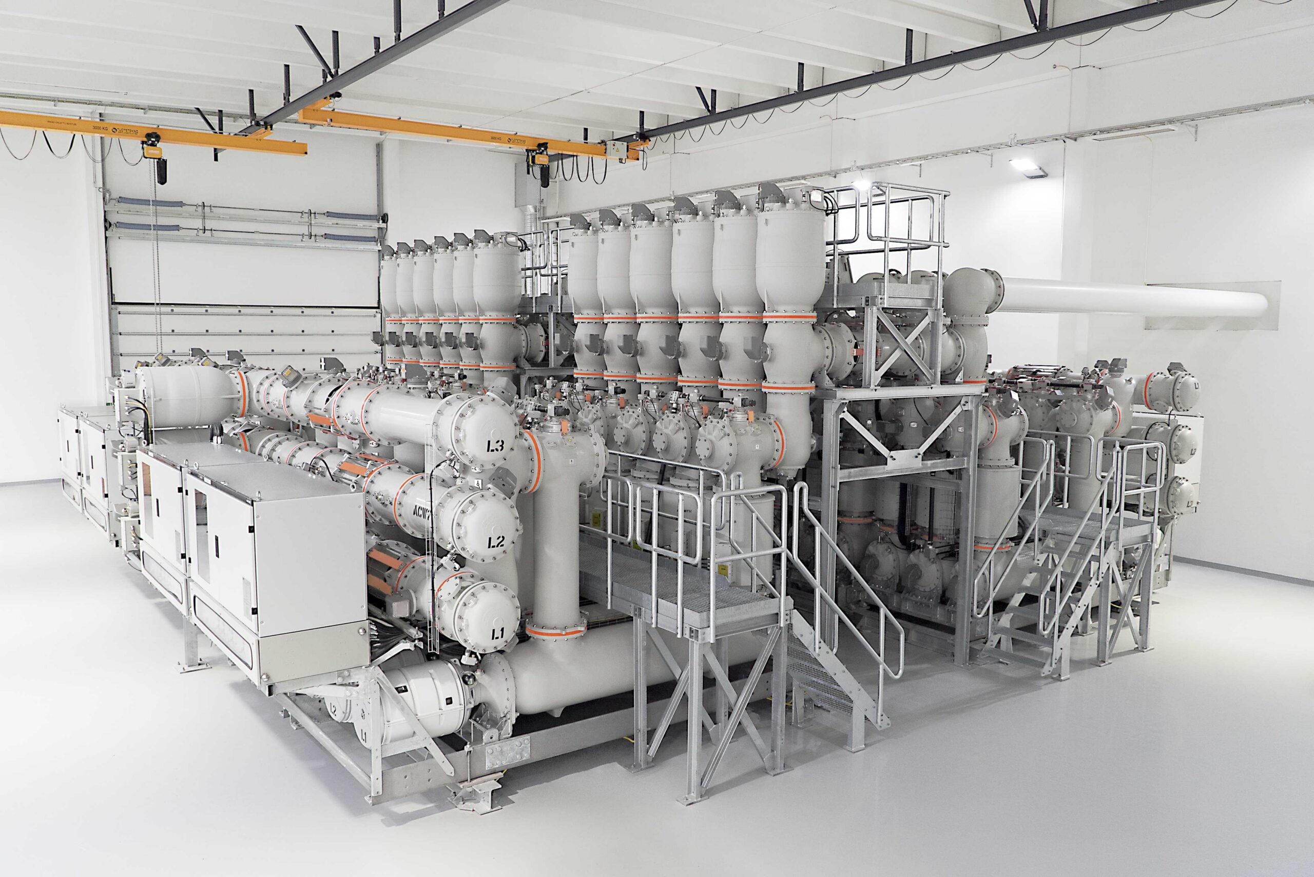 An indoor gas insulated switchgear (GIS) substation installation featuring sulfur hexafluoride (SF6) insulated circuit breakers and busbars.